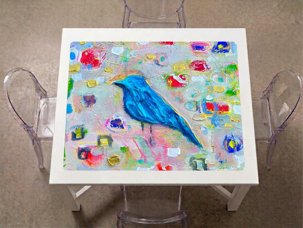 Bluebird Mahjong Mat on a game table with acrylic chairs