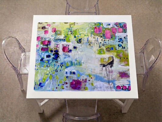 Garden Party Abstract Mahjong Mat on a game table with acrylic chairs